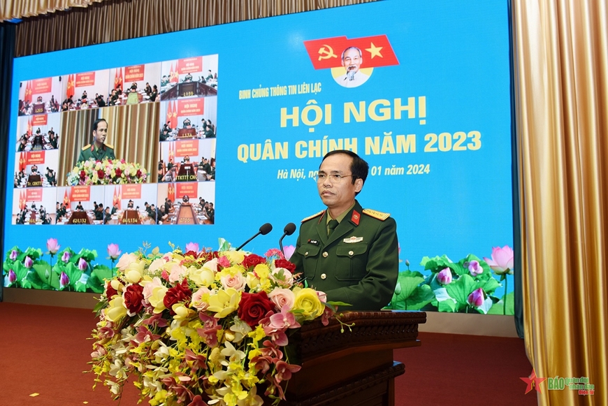 A person in a military uniform standing at a podium with flowers

Description automatically generated